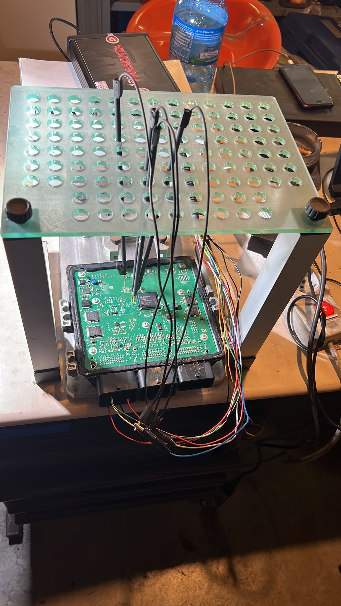 A green electronic device is sitting on top of a table.