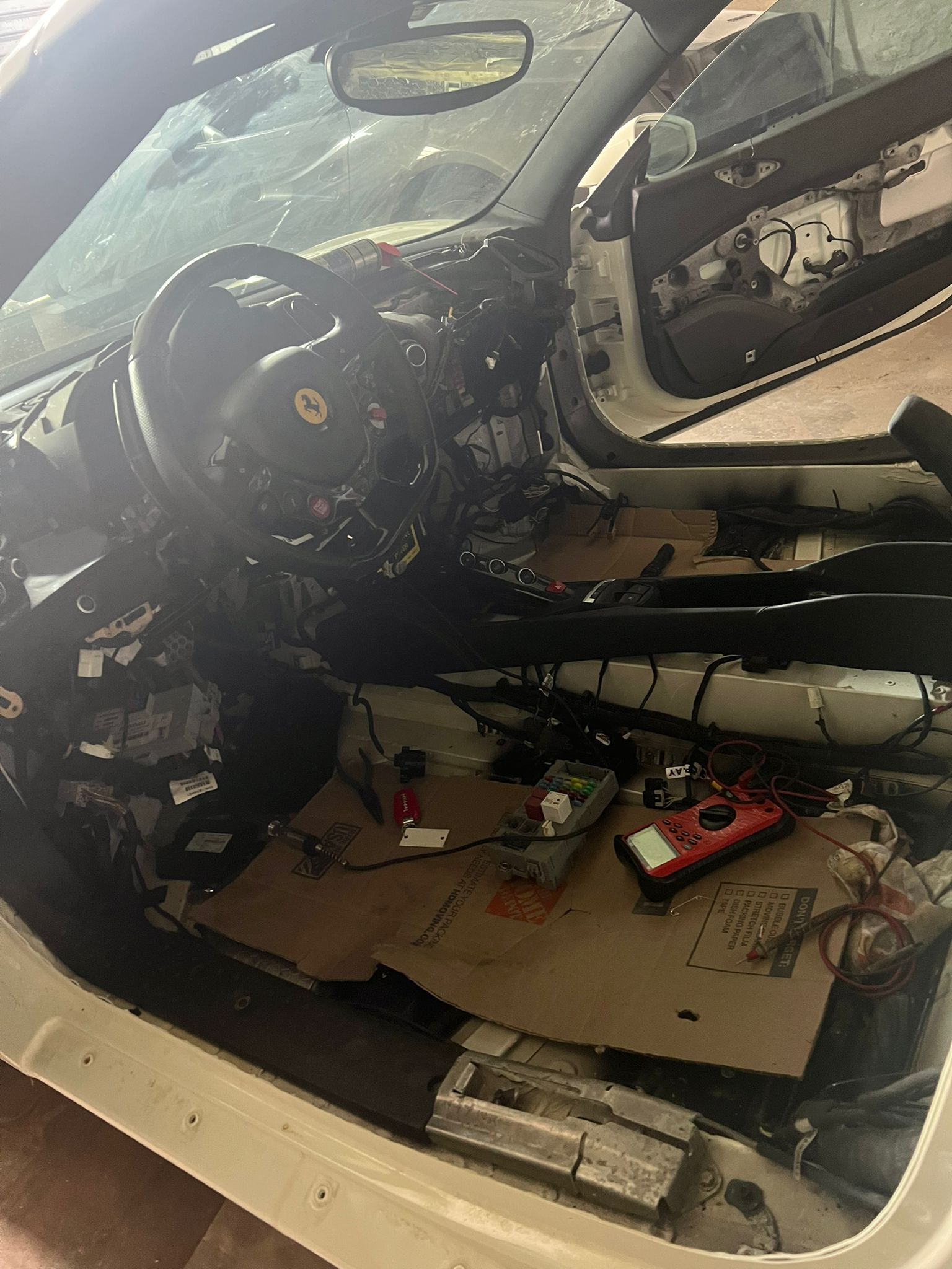 The inside of a car is being worked on.