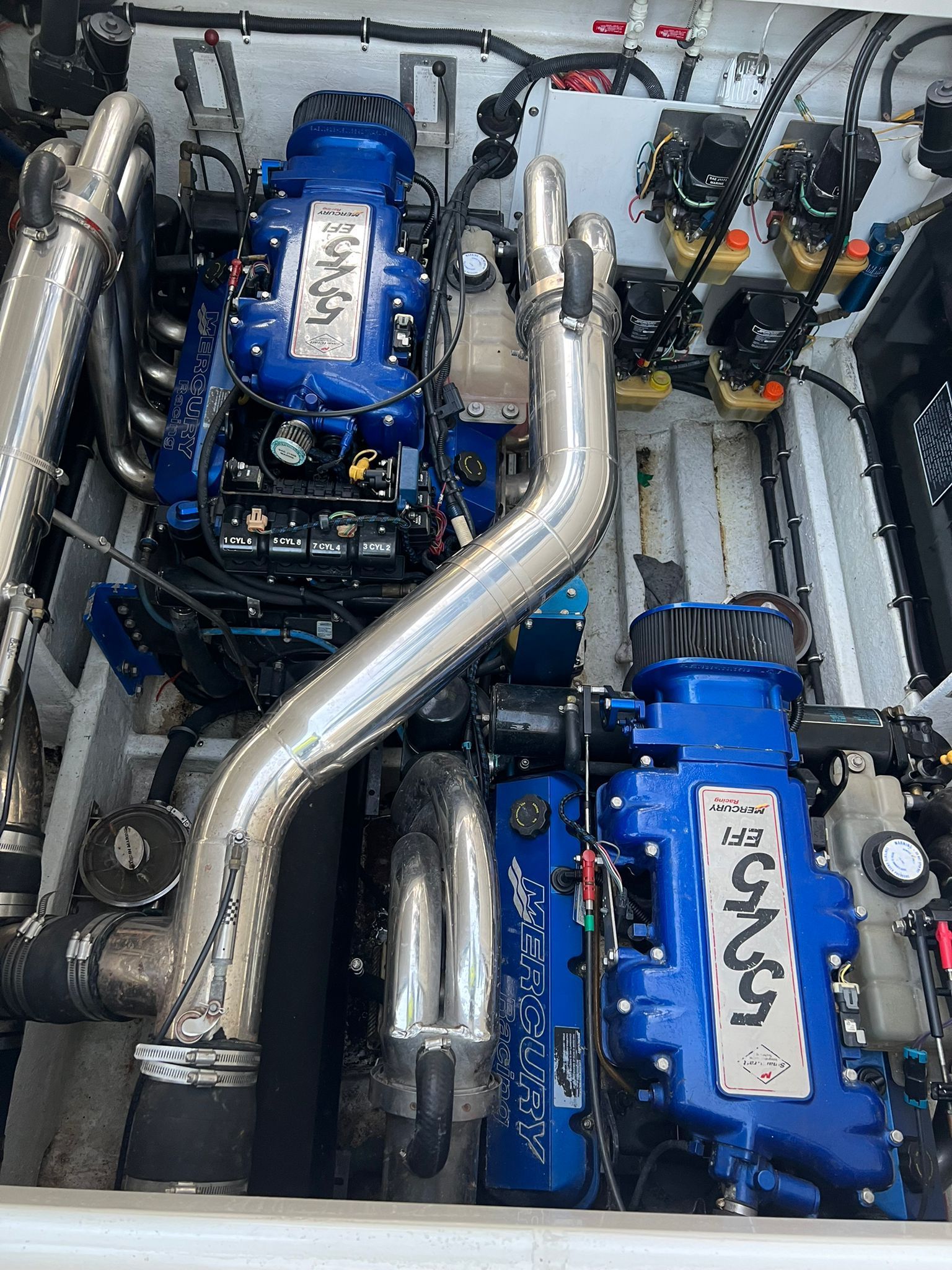 A close up of a blue engine on a boat.