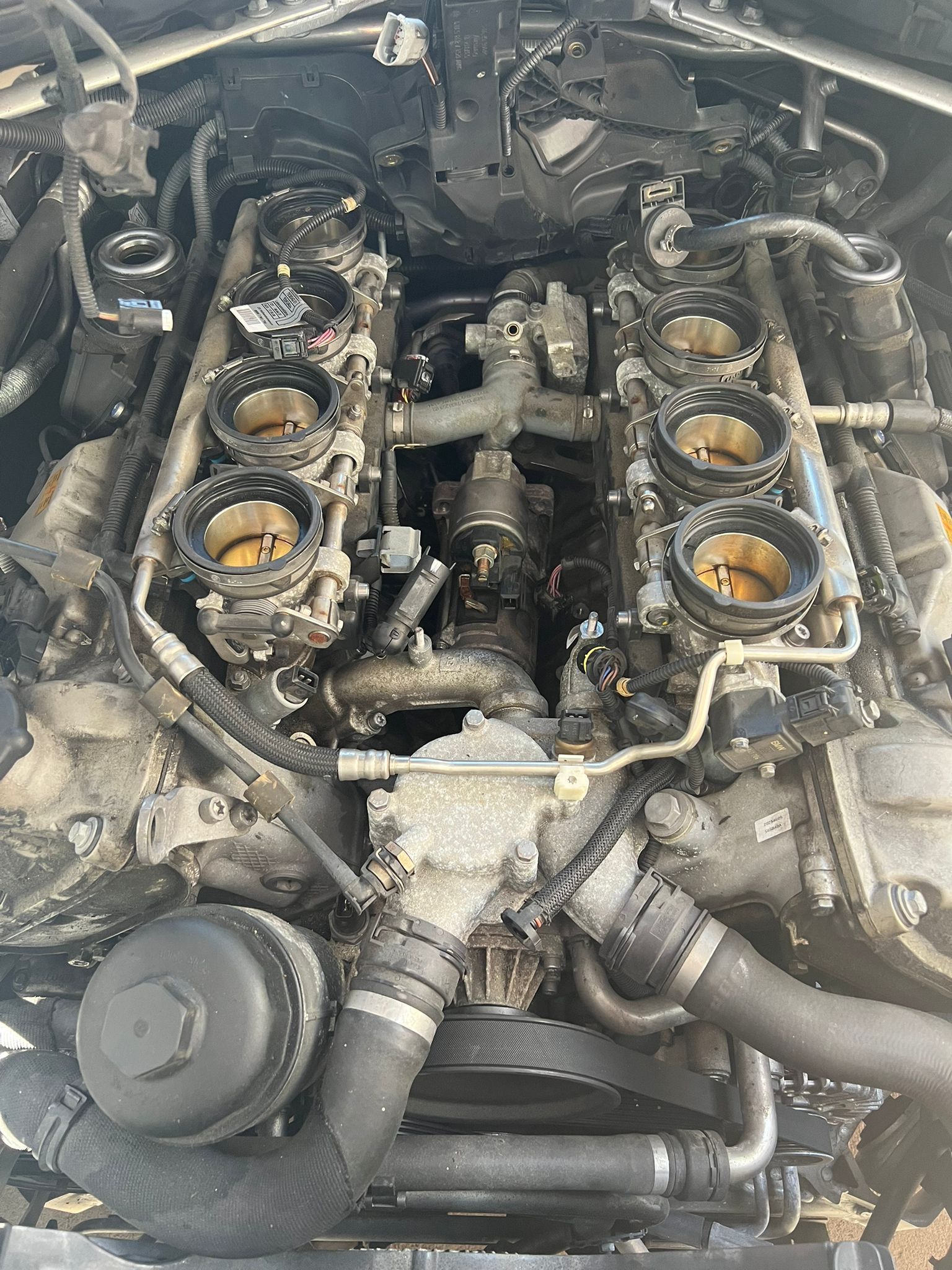 A close up of the engine of a car.