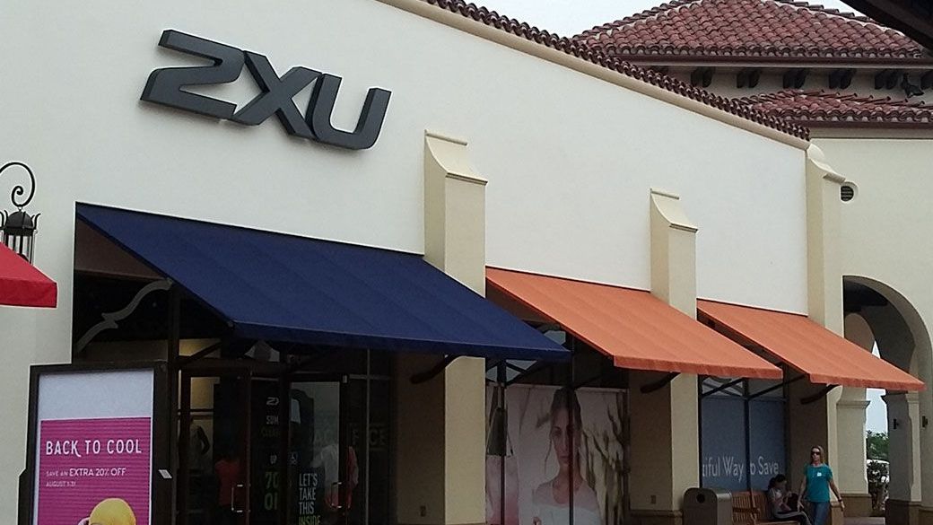 A store front with a row of awnings