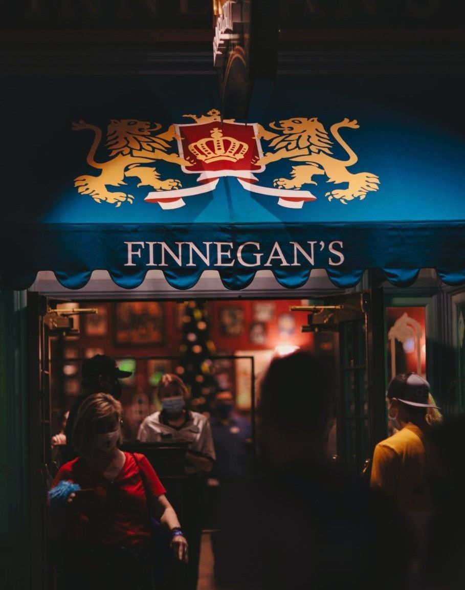 Finnegan 's restaurant has a blue awning with lions on it