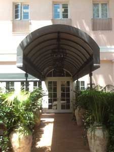 The entrance to a building with a canopy over it