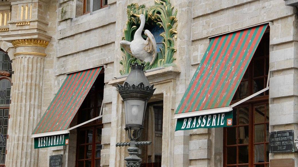 A building with red and green striped awnings