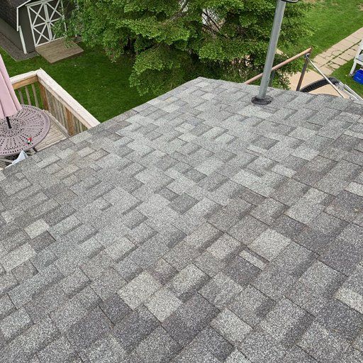 An aerial view of a roof with shingles on it.
