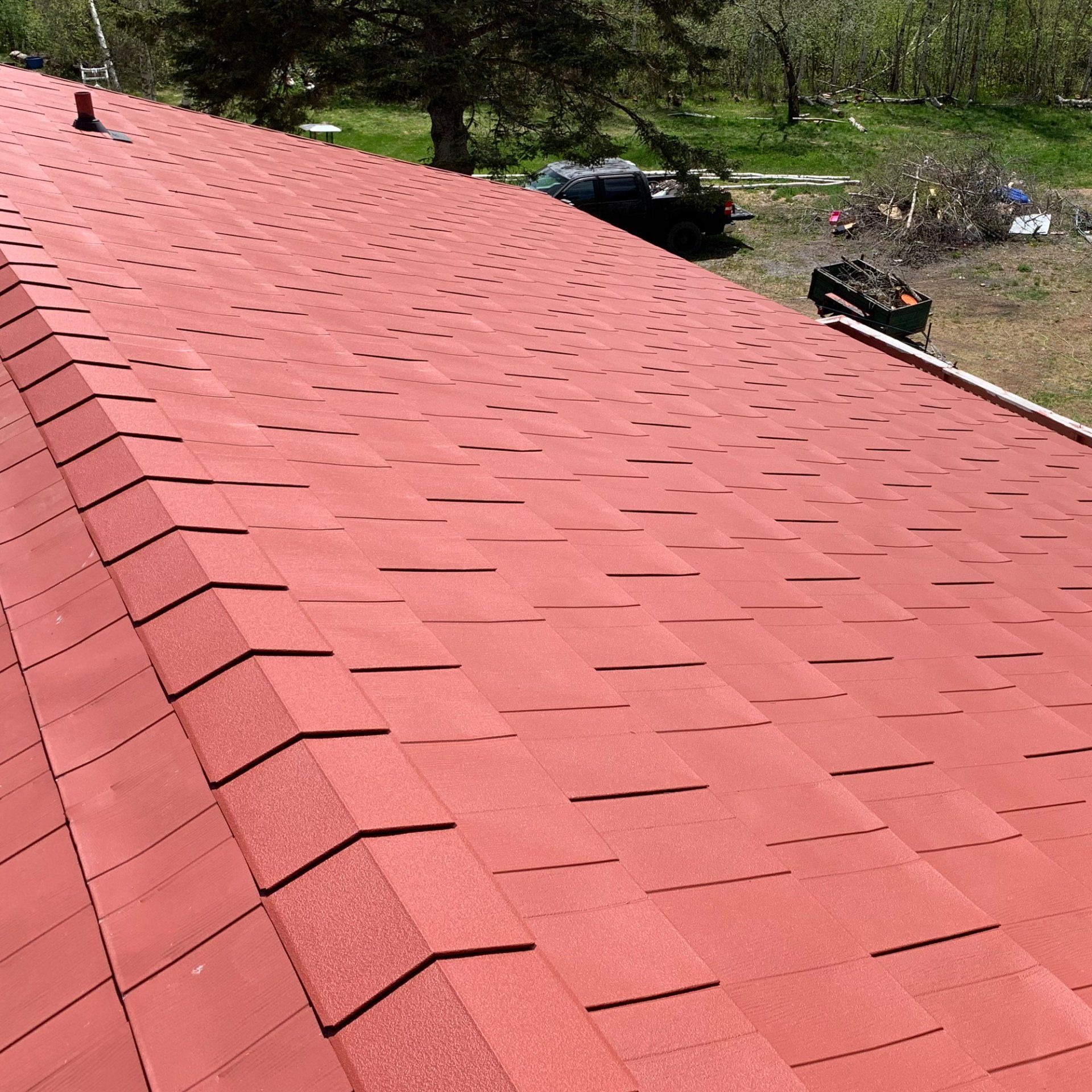 A red roof with a lot of shingles on it