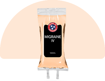 A bag of migraine iv is sitting on a table.