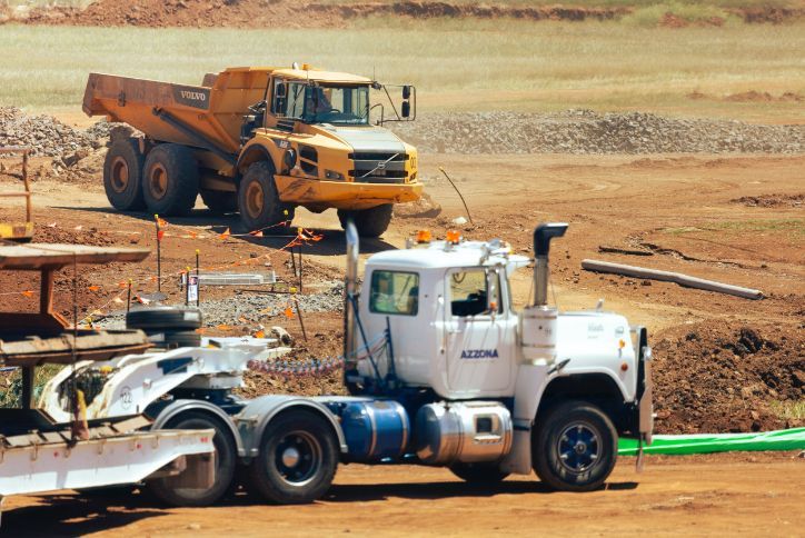 A Semi Truck is Parked Next to a Dump Truck — Wilsons Plant in Nowra, NSW