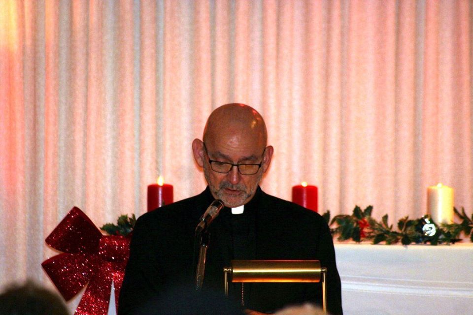 Man giving speech at Christmas