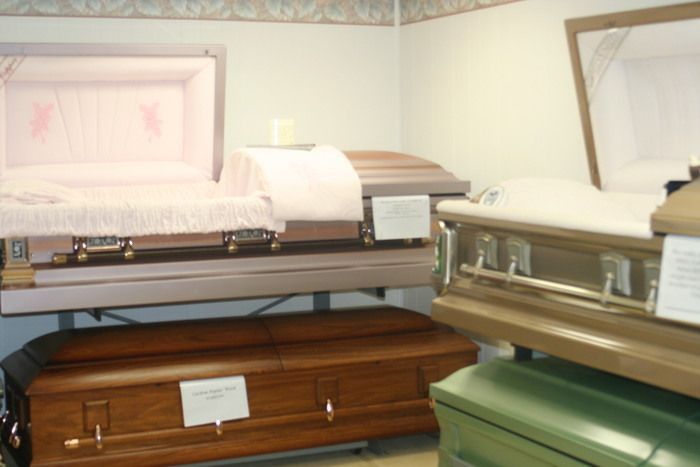 a row of coffins are lined up in a room