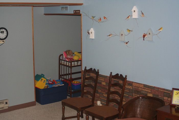 a room with chairs and a clock on the wall