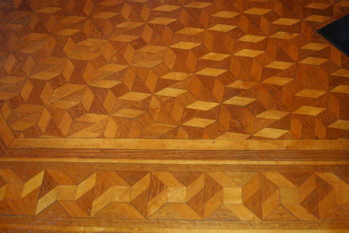 a wooden floor with a geometric pattern on it