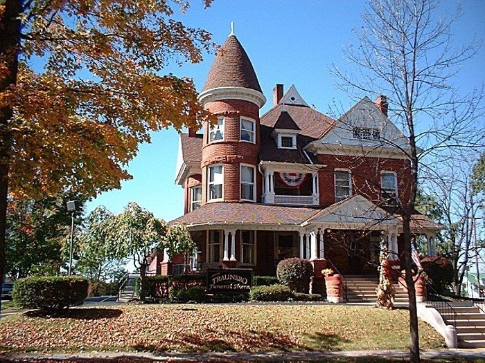 a large brick house with a tower on top of it