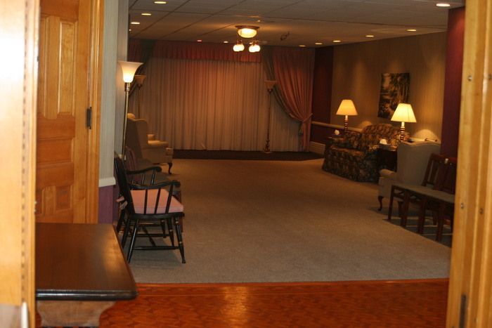 a room with a table and chairs in it