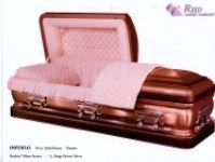 a copper casket with a pink blanket inside of it .
