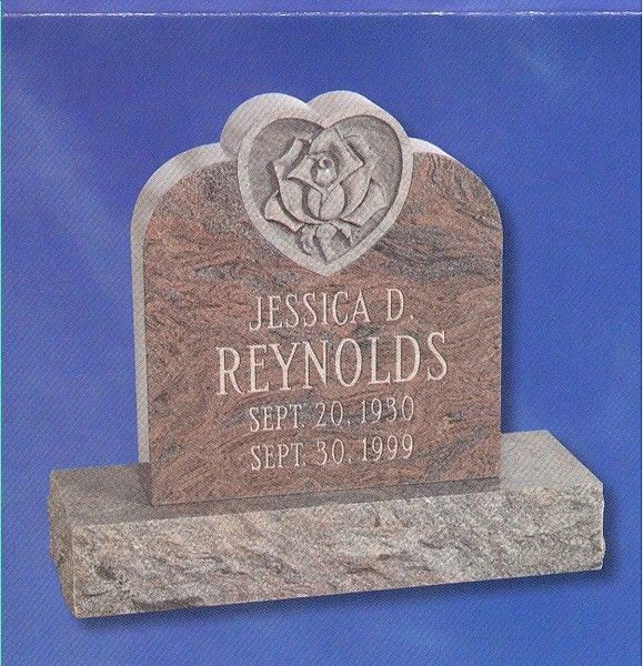 Headstone that is upright and with a rose