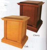 a picture of two wooden urns in oak and cherry .