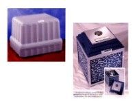 a white urn vault and a blue urn vault are sitting next to each other on a table .