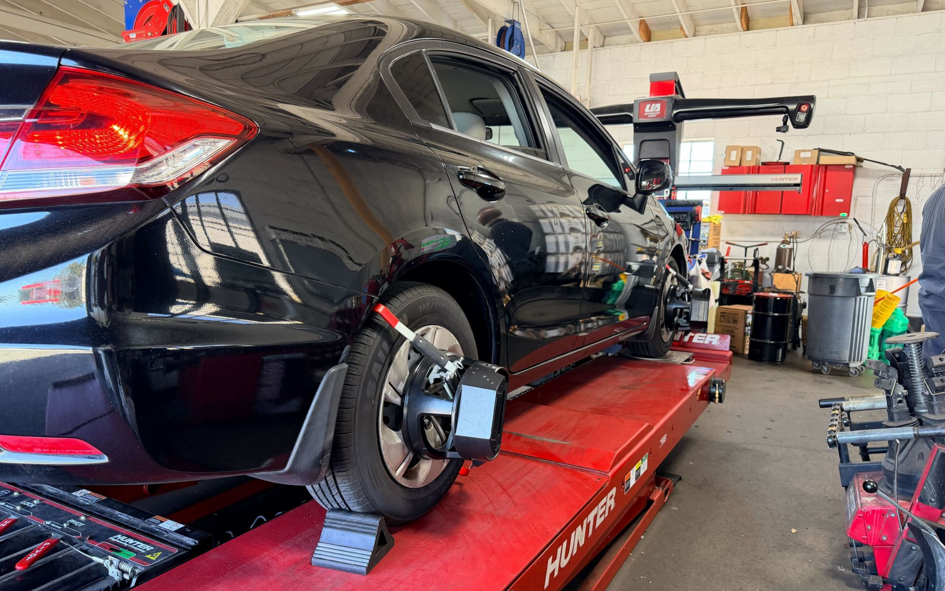 Vehicle on alignment rack during wheel alignment service at Wayside Garage in Seaside CA