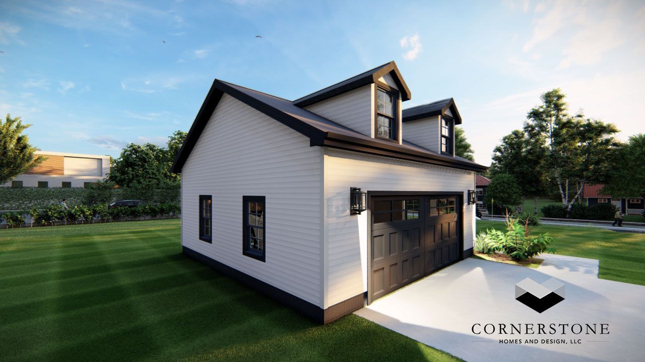 A white house with a black garage door is sitting on top of a lush green field.
