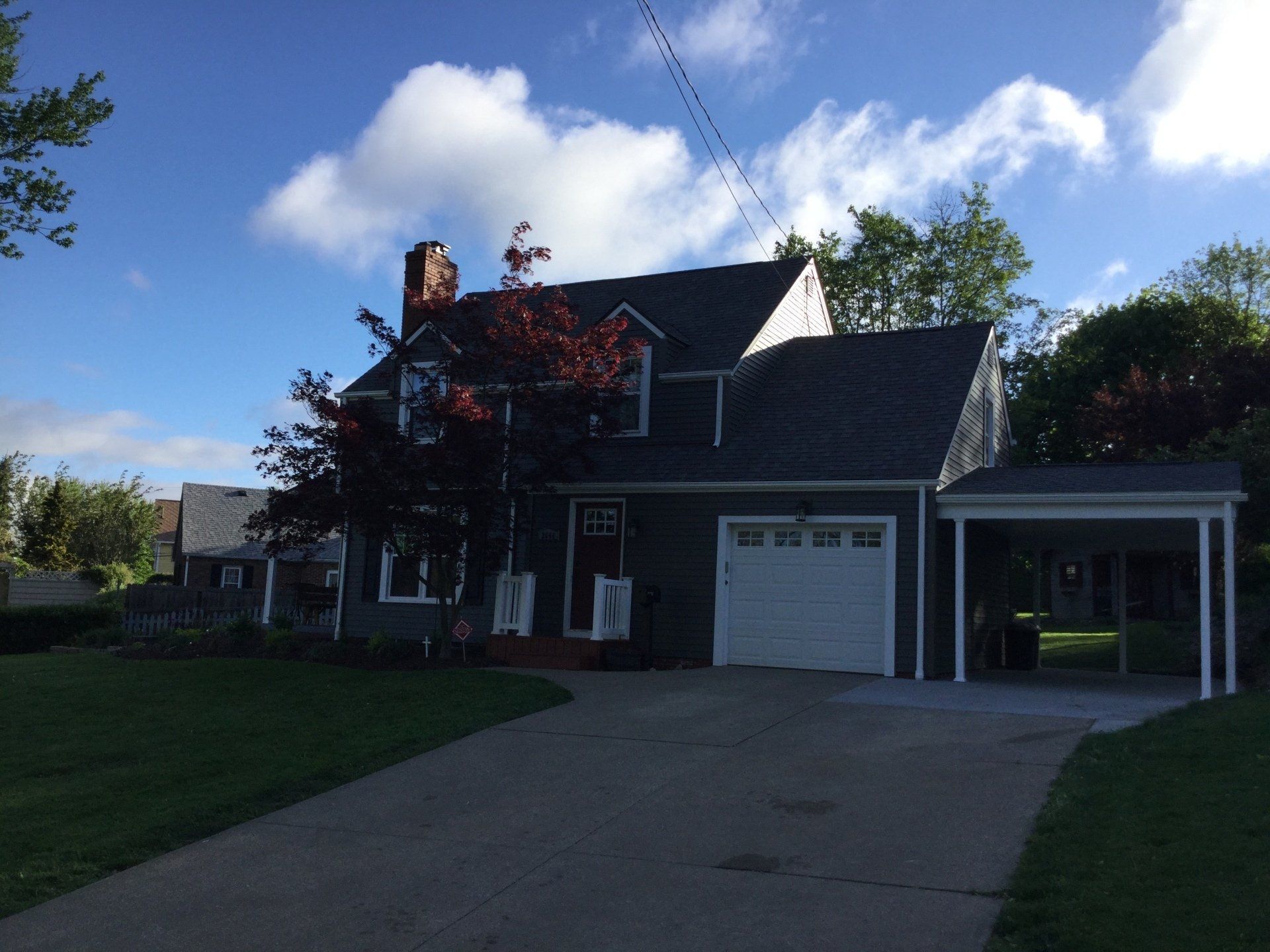 A house with a white garage door and a driveway