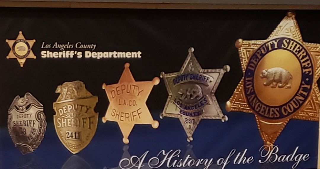 A collection of sheriff 's badges from the los angeles county sheriff 's department