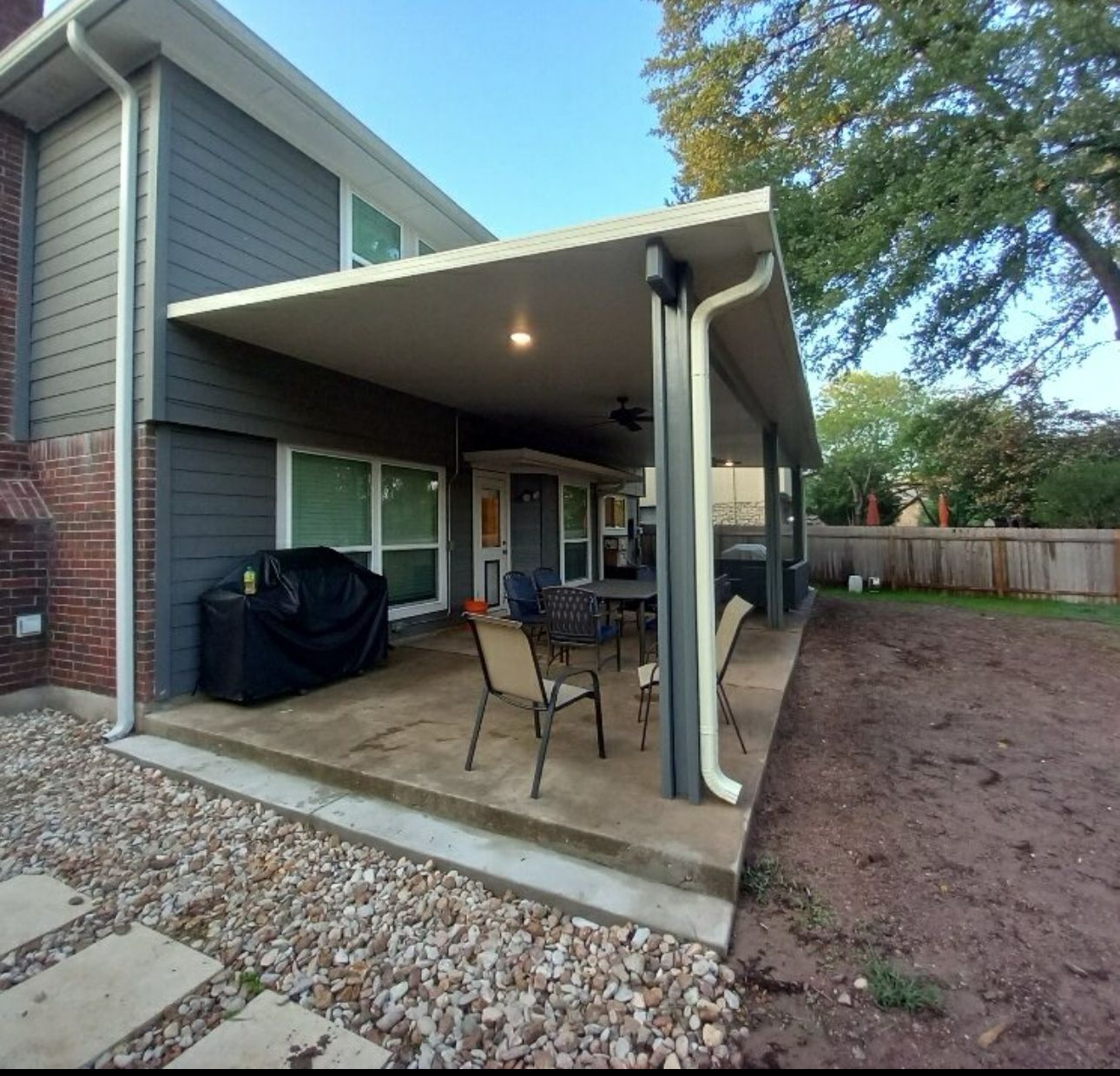 Insulated patio cover with stamped concrete in Shadow Creek Ranch, Pearland