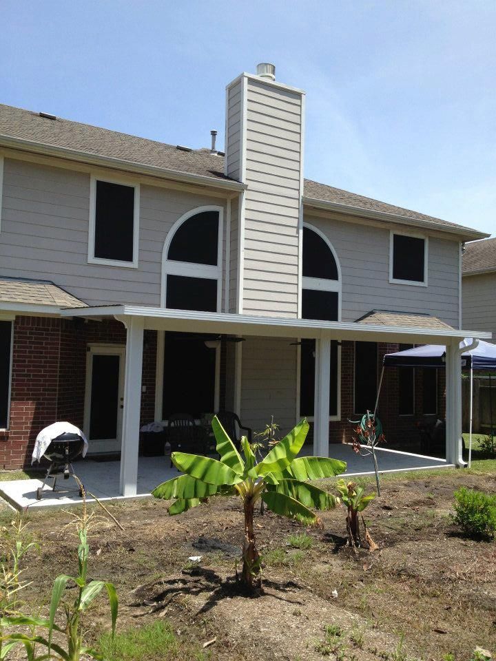 Patio builder installation in Towne Lake TX with aluminum roof and stamped concrete