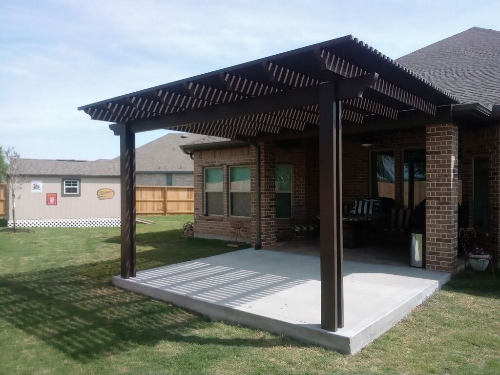 Aluminum pergola in Montgomery, TX installed with concrete patio and rain proof cover