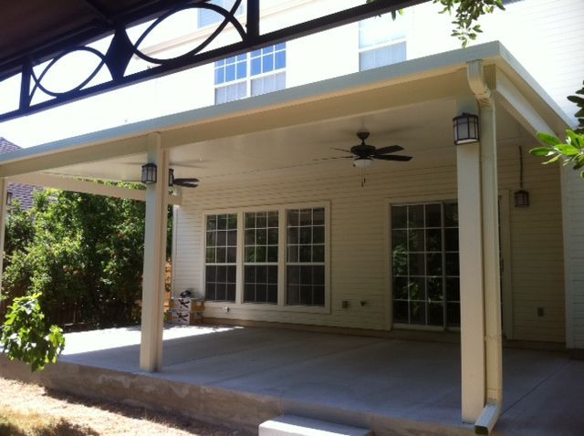 Lone Star Patio Builders in Montgomery, TX built this attached patio cover in Walden on Lake Conroe