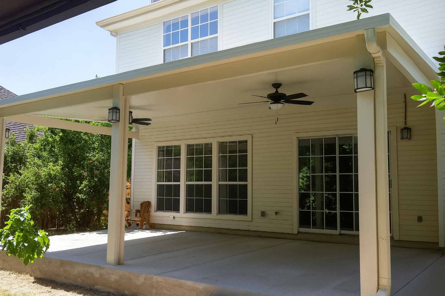 Patio cover in Houston TX with fan and gutter system