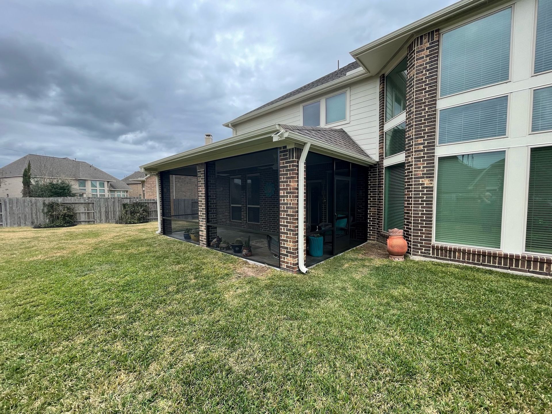 Covered patio in Fulshear, TX with skylights for natural lighting and enhanced ambiance.