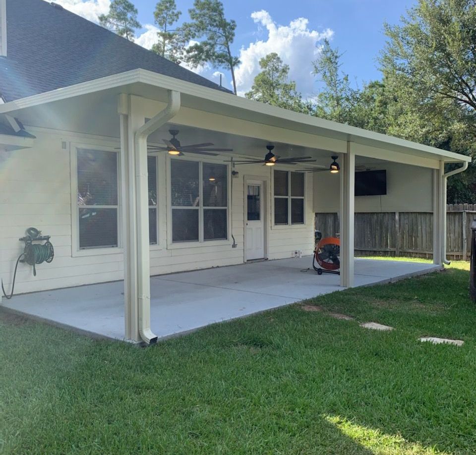 Our skilled contractors installing a custom outdoor covered patio in Katy, TX