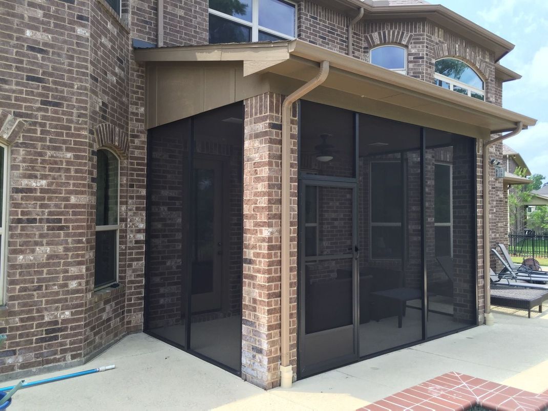A serene, screened-in backyard retreat in Katy, TX, offering complete mosquito protection.