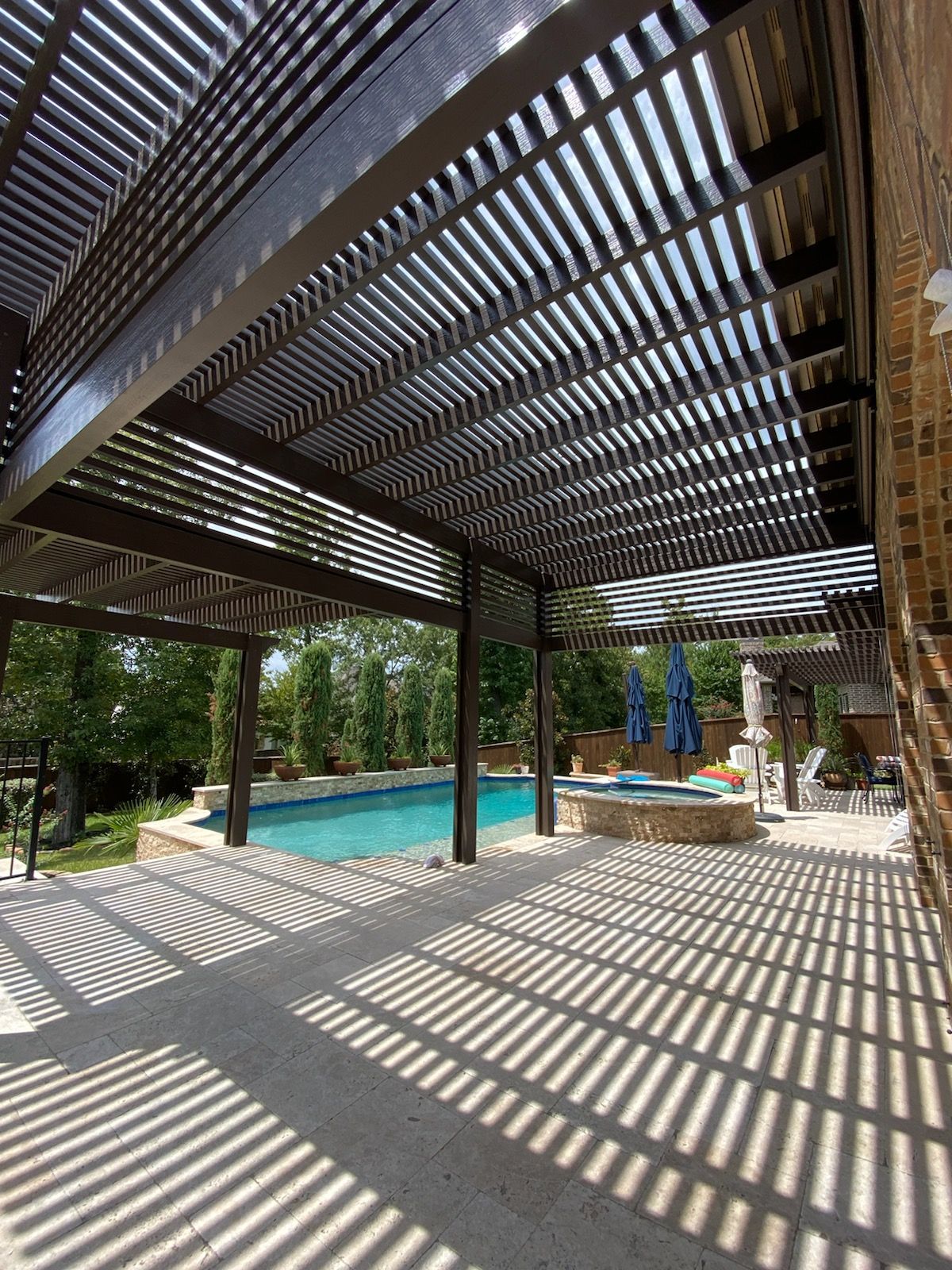 Houston patio builder project with aluminum roof and integrated lighting