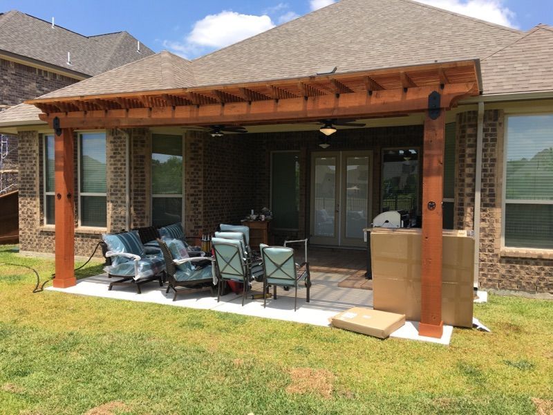Custom patio cover in Richmond, TX with fan installation