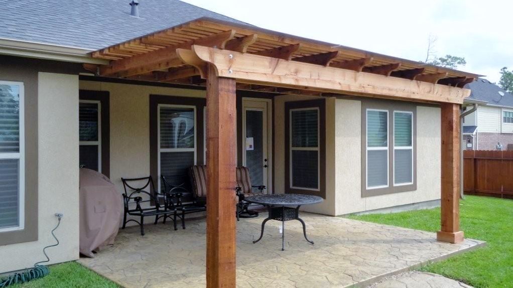 Pergola with stain and polycarbonate roof in Humble, TX.