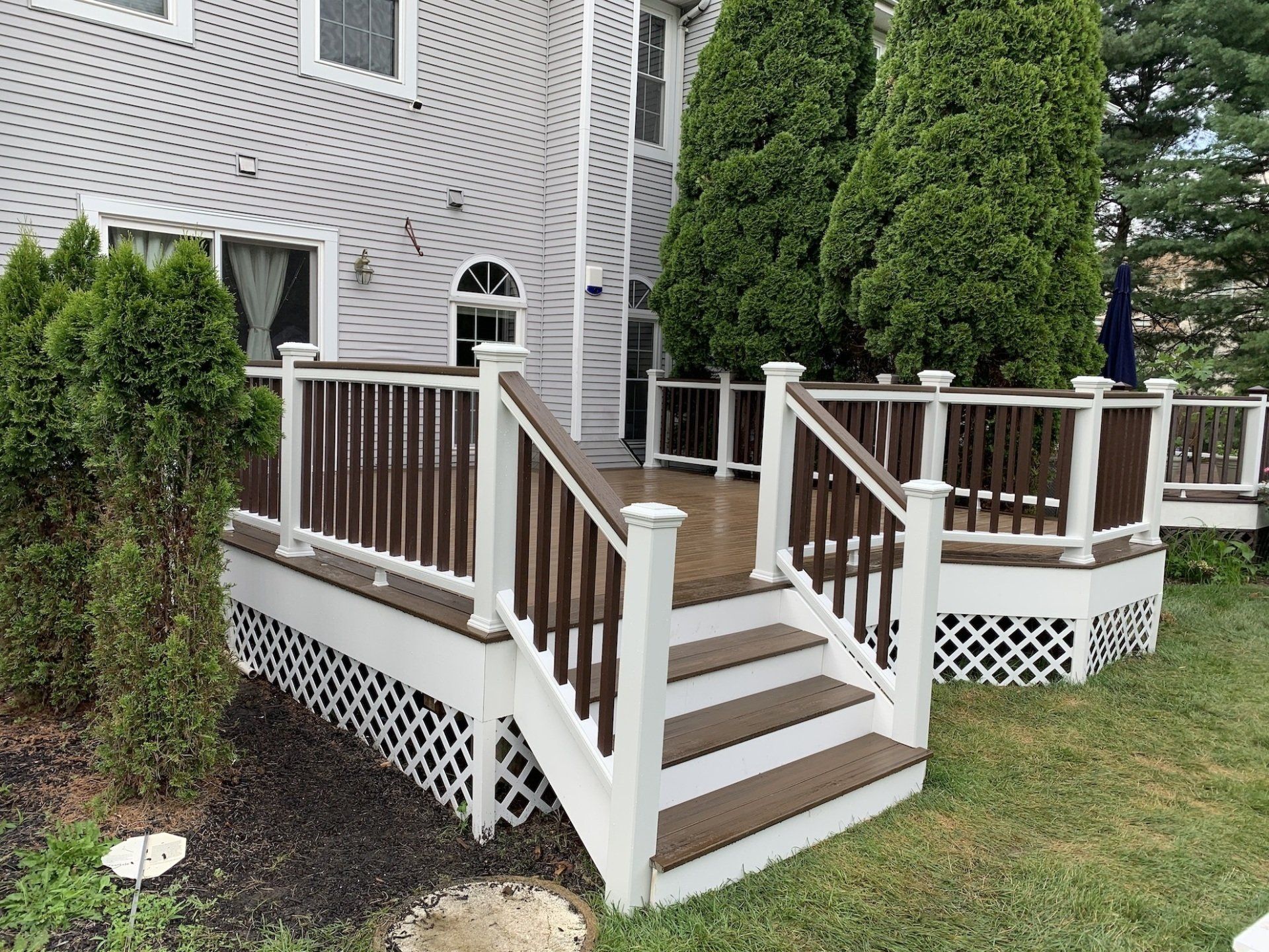 medium size deck with railing off the back door
