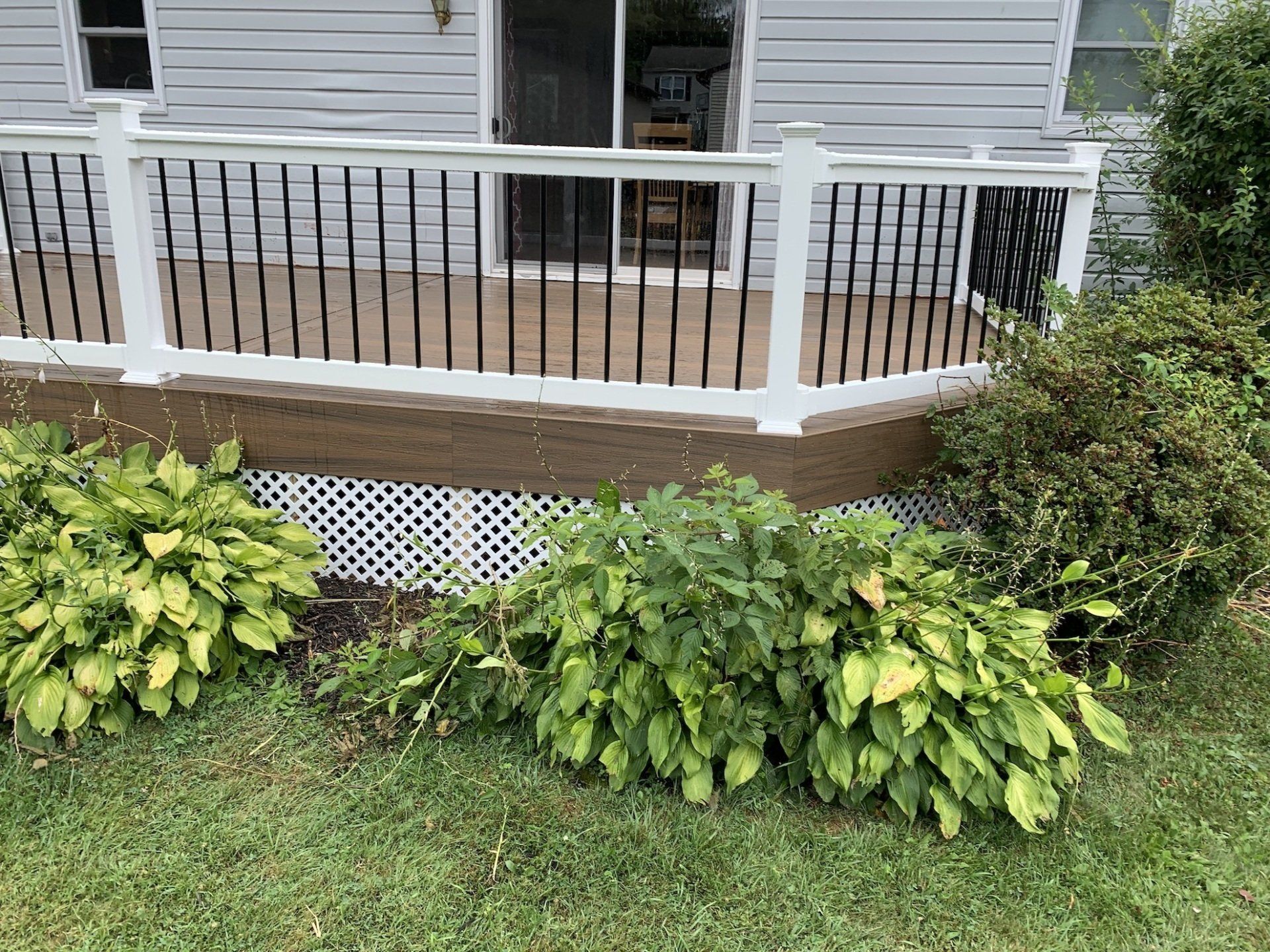 new backyard deck with railings and steps