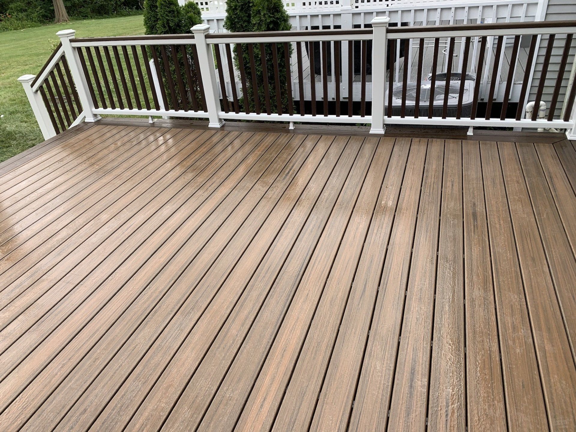 another view of completed deck with white and black railing