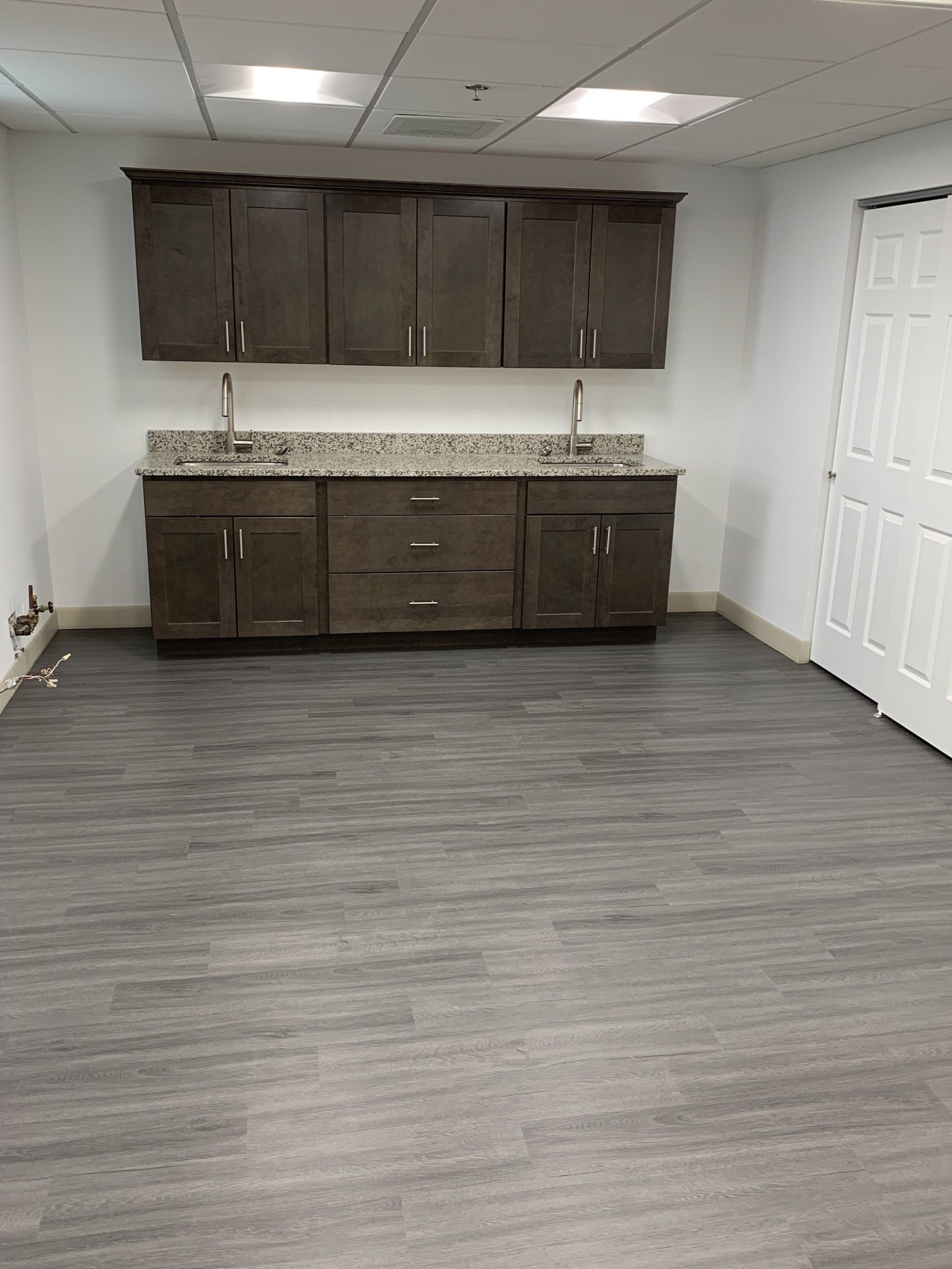 basement renovation with upper and lower cabinets installed