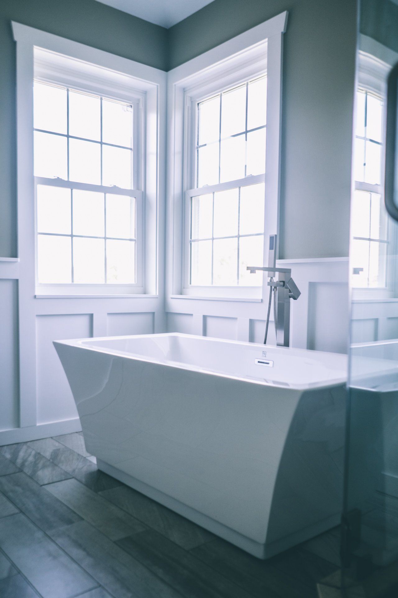 bathroom renovation with new window and stand alone tub