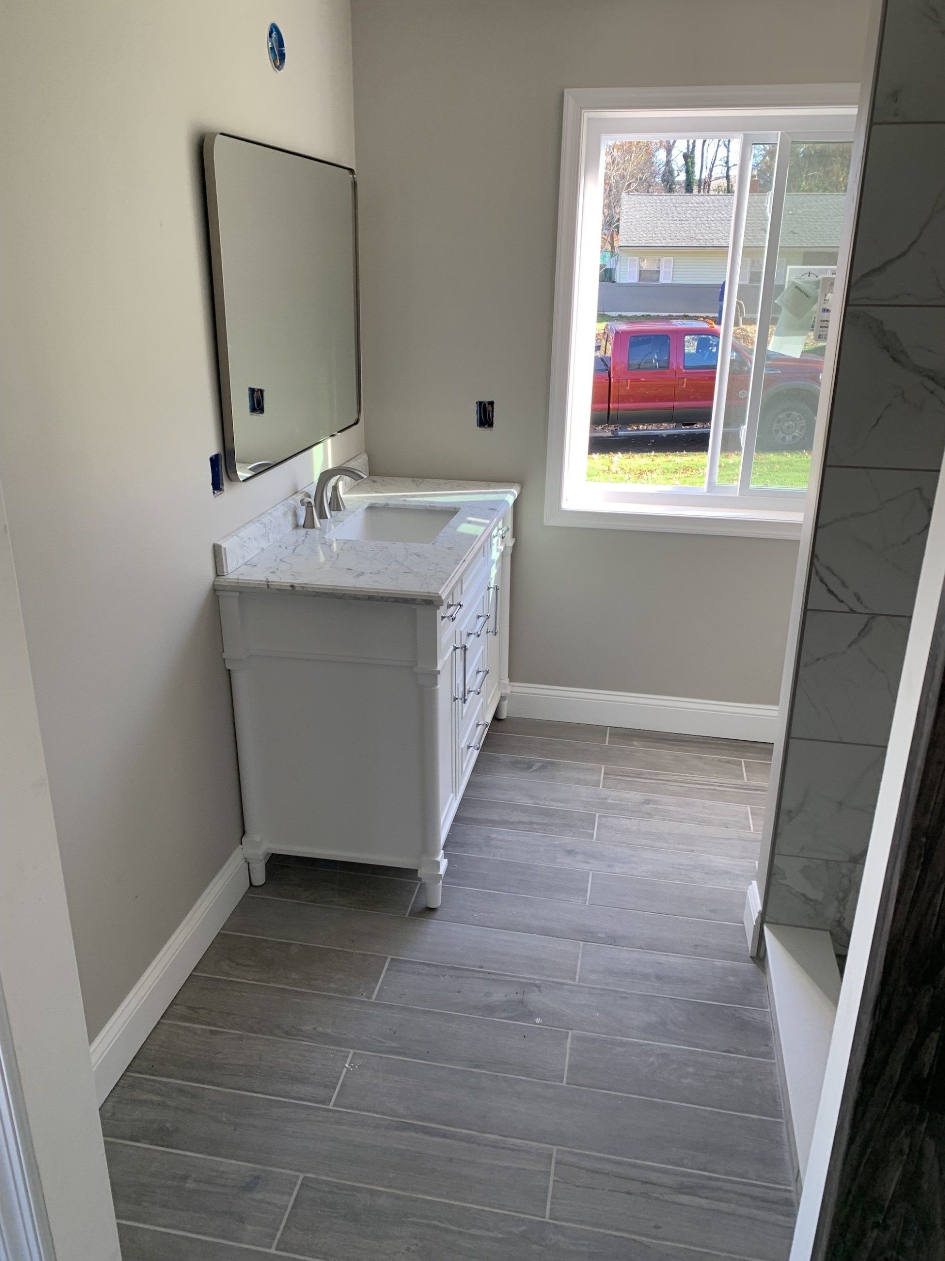 bathroom remodel with new floor, sink, shower