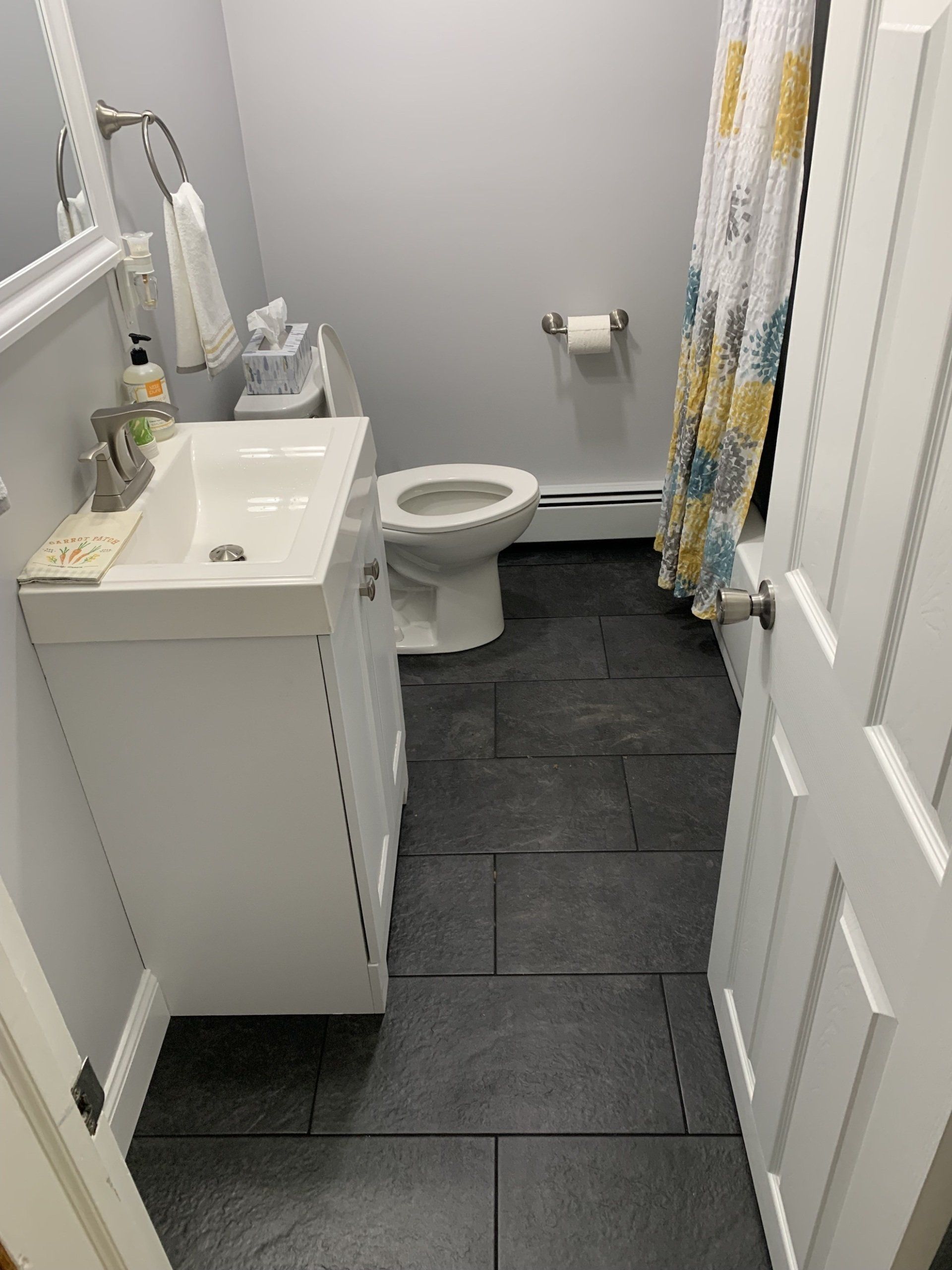 bathroom dark floor tile installation