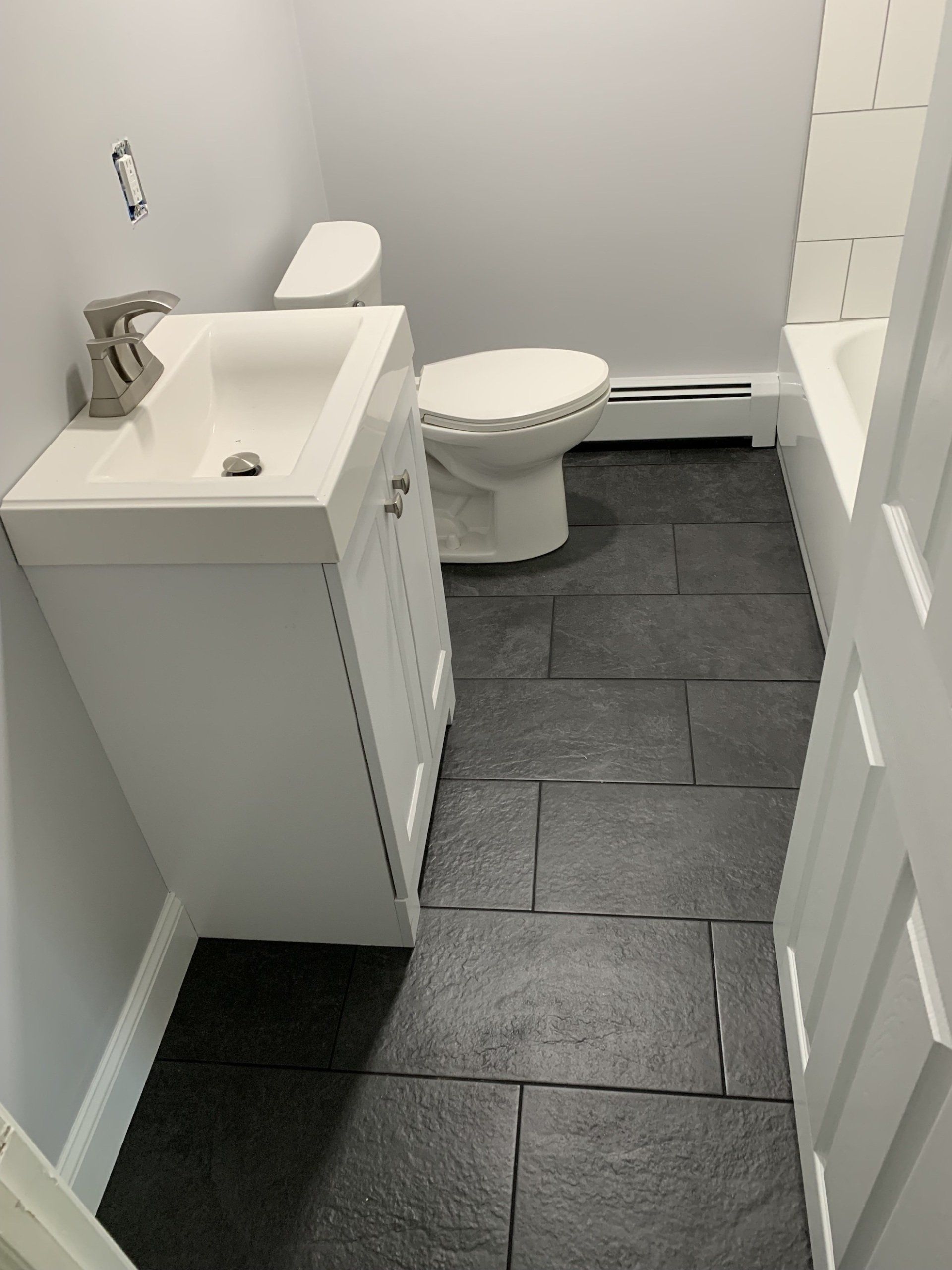 remodeling of the bathroom adding tile floors