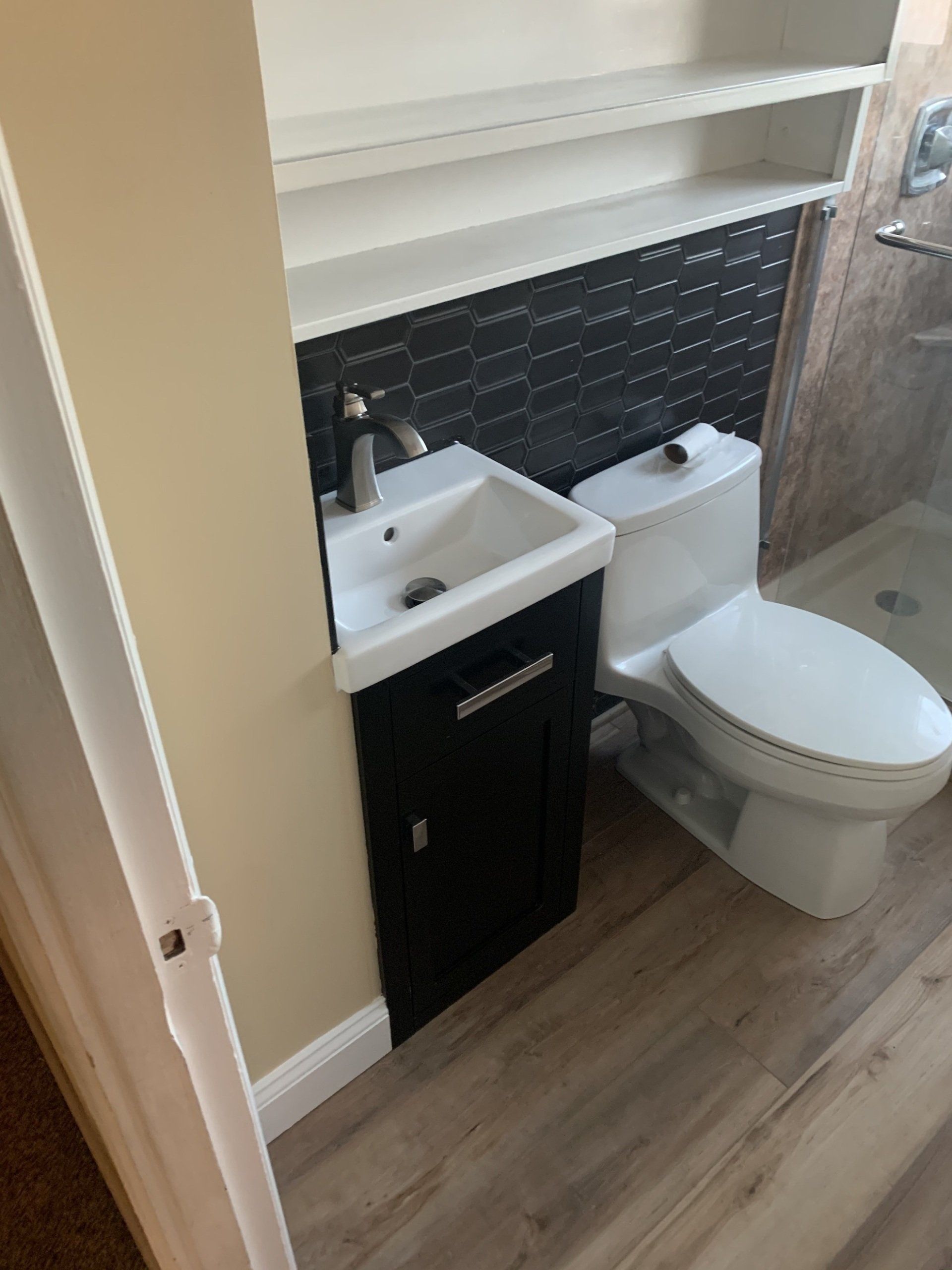 bathroom remodel with new wood floor