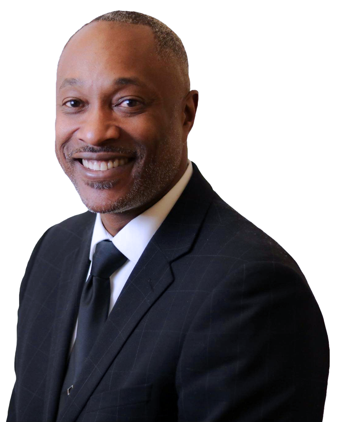 Pastor Paul D. Flowers Sr. in a suit and tie is smiling for the camera