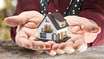 Estate Planning — Miniature House In His Hands  in Danville, IL