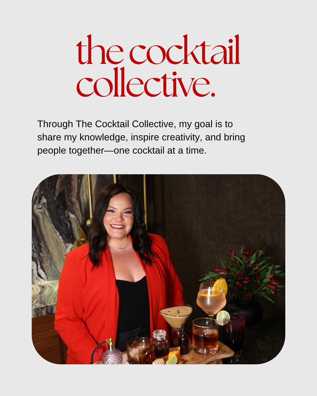 A woman in a red jacket is standing in front of a table full of cocktails.