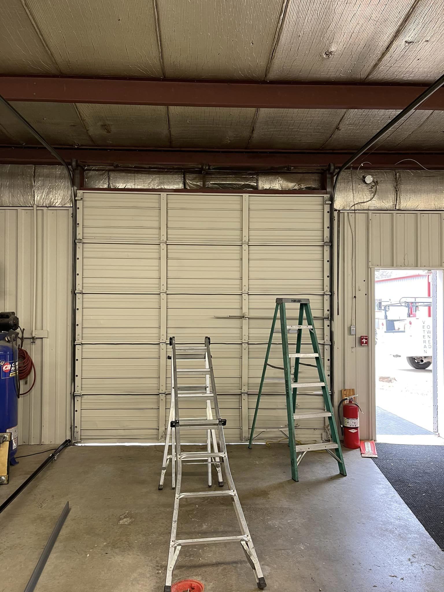 White Garage Door Installation — Okmulgee, OK — Kingdom Door Company